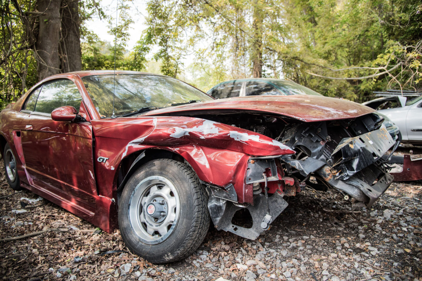 Red damaged car with crushed front end